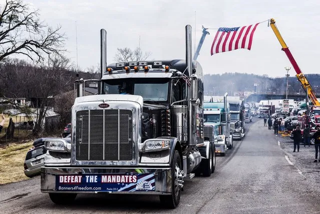 Hundreds of vehicles including 18-wheeler trucks, RVs and other cars depart the Hagerstown Speedway after some of them arrived as part of a convoy that traveled across the country headed to Washington D.C. to protest COVID-19 related mandates and other issues in Hagerstown, Maryland, U.S., March 6, 2022. (Photo by Stephanie Keith/Reuters)