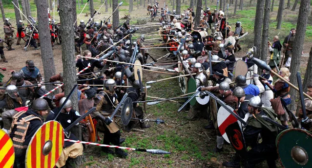 Participants dressed as characters such as elves, dwarves, goblins and orcs from the J.R.R. Tolkien's novel “The Hobbit” re-enact the “Battle of Five Armies” in a forest near the town of Doksy, Czech Republic, June 4, 2016. (Photo by David W. Cerny/Reuters)