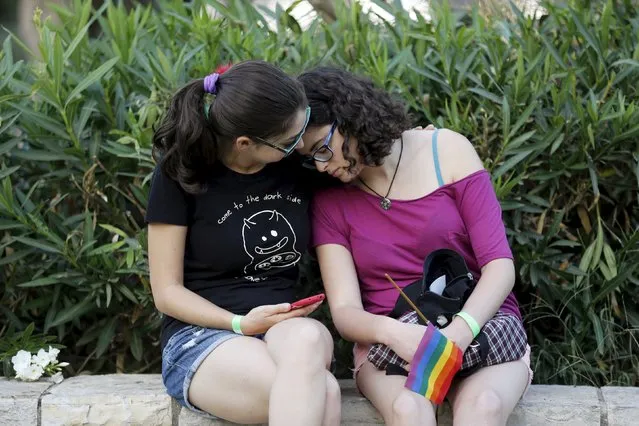 Participants of an annual gay pride parade react after an Orthodox Jewish assailant stabbed and injured six participants in Jerusalem on Thursday, police and witnesses said July 30, 2015. (Photo by Amir Cohen/Reuters)