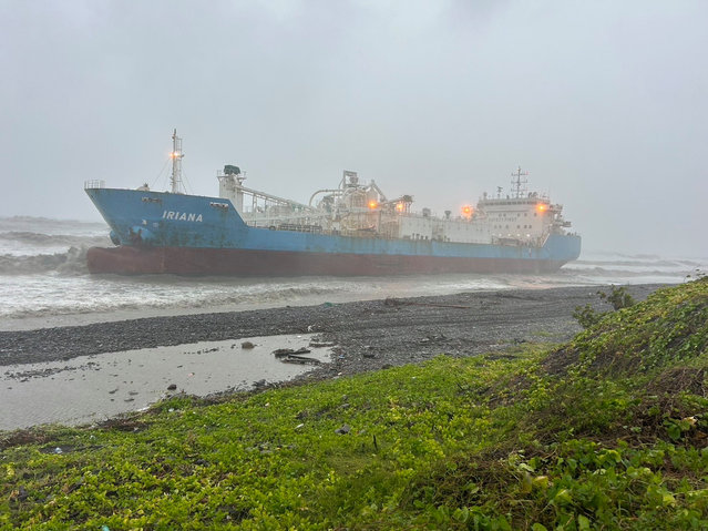 A handout photo made available by the Taiwan Coastguard Administration shows the Indonesian-flagged special cement ship 'Iriana' that ran aground due to Typhoon Gaemi, northwest of Fangshang Township in Pingtung County, Taiwan, 25 July 2024. According to the Taiwan Coastguard, a Tanzania-flagged ship carrying nine Myanmar nationals sank off the southern coast of Taiwan on 25 July when Typhoon Gaemi struck. Four other foreign vessels ran aground, but the personnel onboard are safe. (Photo by Taiwan Coastguard Administration Handout via EPA/EFE)