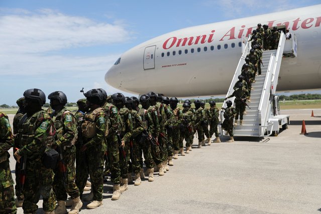 Members of the second contingent of Kenyan police disembark after arriving in the Caribbean country as part of a peacekeeping mission, in Port-au-Prince, Haiti on July 16, 2024. (Photo by Ralph Tedy Erol/Reuters)