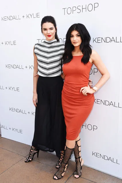 Kendall Jenner (L) and Kylie Jenner attend a launch party for their Kendall + Kylie fashion line at TopShop on June 3, 2015 in Los Angeles, California. (Photo by Jason Merritt/Getty Images/AFP Photo)