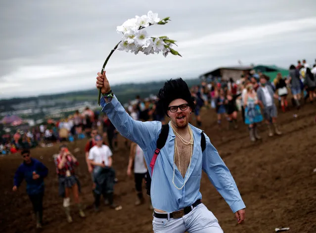 A reveller takes part in the Vloody Cloody Heroes Parade during the Glastonbury Festival at Worthy Farm in Somerset, Britain, June 23, 2016. (Photo by Stoyan Nenov/Reuters)
