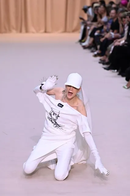 A model stumbles during Jean Paul Gaultier's Haute Couture Fall/Winter 2022-2023 fashion collection presented Wednesday, July 6, 2022 in Paris. (Photo by Pascal Le Segretain/Getty Images)