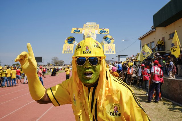 A Citizens for Coalition Change (CCC) supporter poses for a photograph during the opposition party's election campaign rally at White City Stadium in Bulawayo, Zimbabwe on August 20, 2023. (Photo by K.B. Mpofu/Reuters)