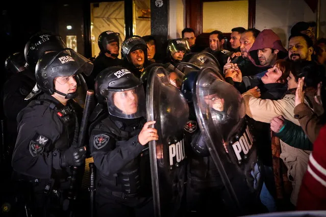 Police arrive to control protesters, both opponents and supporters of Argentinian Vice President Cristina Fernandez, who gathered outside her home after a state prosecutor asked for a 12-year prison sentence for Fernandez, in Buenos Aires, Argentina, 22 August 2022. The prosecutor said in his closing statement of a trial that began in 2019 that Fernandez was the head of 'systematic corruption' around a public works contract. (Photo by Juan Ignacio Roncoroni/EPA/EFE)
