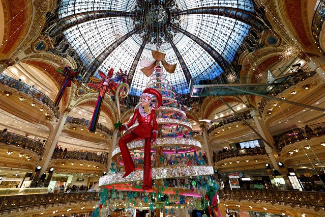 A giant decorated Christmas tree stands at the Galeries Lafayette department store for the Christmas festive season in Paris, France on November 15, 2023. (Photo by Gonzalo Fuentes/Reuters)