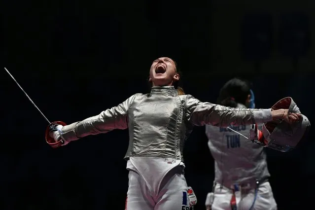 France's Manon Brunet celebrates winning against Tunisia's Azza Besbes in their womens individual sabre quarter-final bout as part of the fencing event of the Rio 2016 Olympic Games, on August 8, 2016, at the Carioca Arena 3, in Rio de Janeiro. (Photo by Kirill Kudryavtsev/AFP Photo)