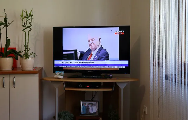 Former Bosnian Serb general Ratko Mladic is seen on a television screen in the home of one of the victims in Potocari near Srebrenica, Bosnia and Herzegovina,  during his court proceedings at the International Criminal Tribunal for the former Yugoslavia (ICTY) in the Hague, November 22, 2017. (Photo by Dado Ruvic/Reuters)