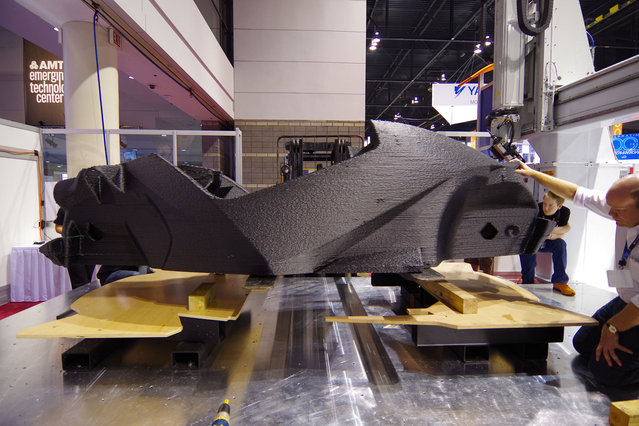 The world's first 3D printed car – the Stratti – was built in just 45 hours at the International Manufacturing Technology Show which took place between September 8 – 13, 2014. The Strati, which is Italian for layers, has a chassis body made of one solid piece and has a top speed of 40mph. (Photo by Barcroft Media/ABACAPress)