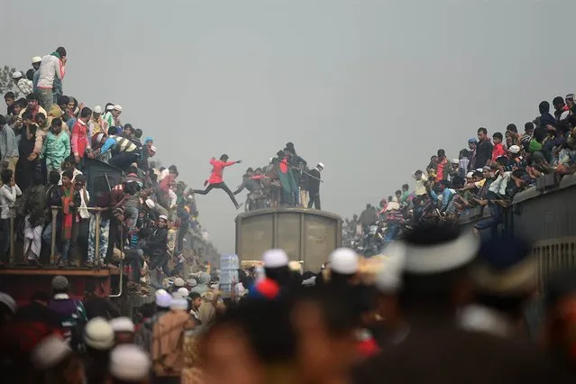 Muslim devotees arrive on overcrowded trains to attend the Biswa Ijtema, or World Muslim Congregation, at Tongi, Bangladesh, on January 13, 2013. At least 3 million Muslims joined in prayer on the banks of a river in Bangladesh as the world's second-largest annual Islamic congregation ended. (Photo by Munir Uz Zaman/AFP Photo)