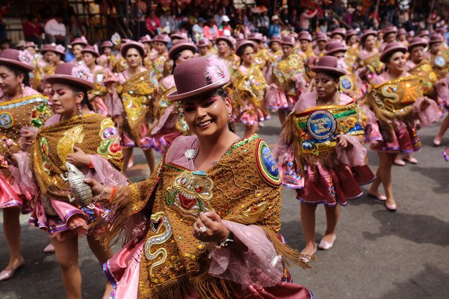 Women wearing traditional clothes dance Morenada during the 2024 Oruro Carnival on February 10, 2024 in Oruro, Bolivia. Listed as one of the Masterpieces of the Oral and Intangible Heritage of Humanity by UNESCO, the Oruro Carnival gathers over 35,000 artists between musicians and dancers who participate in the many parades and activities. The carnival is an example of the religious syncretism and well recognized abroad Bolivia for the the famous parade known as “La Diablada”. (Photo by Gaston Brito Miserocchi/Getty Images)