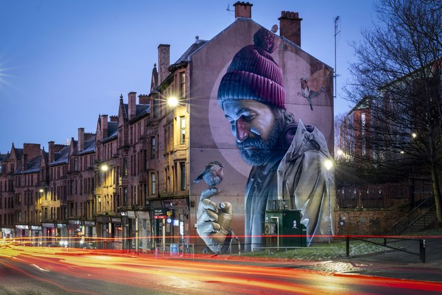 One of Glasgow's best-known murals, by street artist Smug, depicting a modern-day St Mungo and referencing the story of The Bird That Never Flew, on the High Street, Glasgow on Friday, January 10, 2025. January 13 is the feast day of St Mungo, the patron saint and founder of the City of Glasgow. (Photo by Jane Barlow/PA Images via Getty Images)