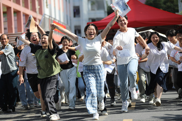 Gaokao candidates run out of an exam venue after the national college entrance exam, or 2025 gaokao, on June 9, 2025 in Yongzhou, Hunan Province of China. China's national college entrance exam began on June 7 this year. The exam in some regions has ended on June 9. (Photo by He Hongfu/VCG via Getty Images)