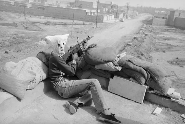 Hooded gunmen supporting Iran's central Islamic government, waiting on rooftop position in Khoramshahr, Iran on Friday, June 1, 1979  for ethic Arab demonstration to pass by.  They later opened fire on the demonstrators who were protesting heavy Arab casualties during two days of bloody fighting with government forces in this key oil-producing area. (Зрщещ ин AP Photo/Sayad)