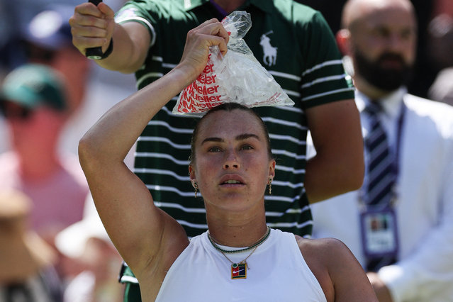 Belarus's Aryna Sabalenka uses an ice pack as she plays against US-Canada's Carson Branstine during their women's singles first round tennis match on the first day of the 2025 Wimbledon Championships at The All England Lawn Tennis and Croquet Club in Wimbledon, southwest London, on June 30, 2025. (Photo by Adrian Dennis/AFP Photo)