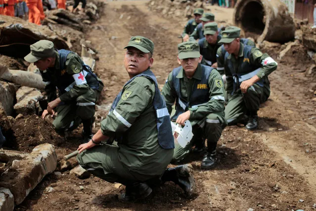 Nicaraguan army members participate in a national multi-hazard drill organized by the National System for Prevention, Mitigation and Attention to Disasters (SINAPRED), in the 30 de Mayo neighborhood in Managua, Nicaragua, September 26, 2016. (Photo by Oswaldo Rivas/Reuters)