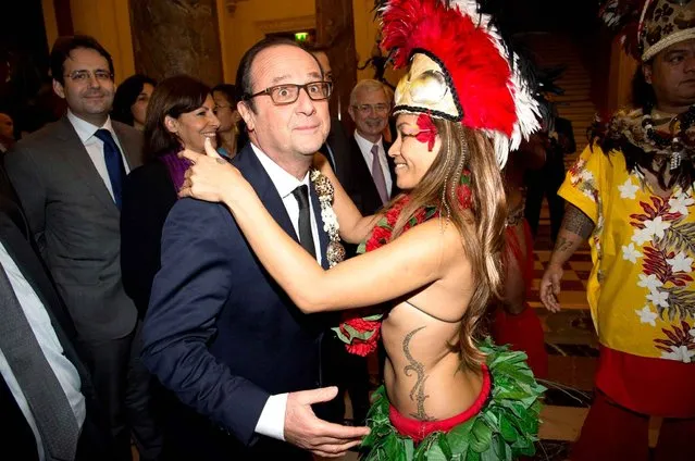 French President Francois Hollande is welcomed as he arrives for a dinner with representatives from the French Overseas Territories, at the City Hall, in Paris, France on November 21, 2014. (Photo by by Pierre Villard/Sipa USA)