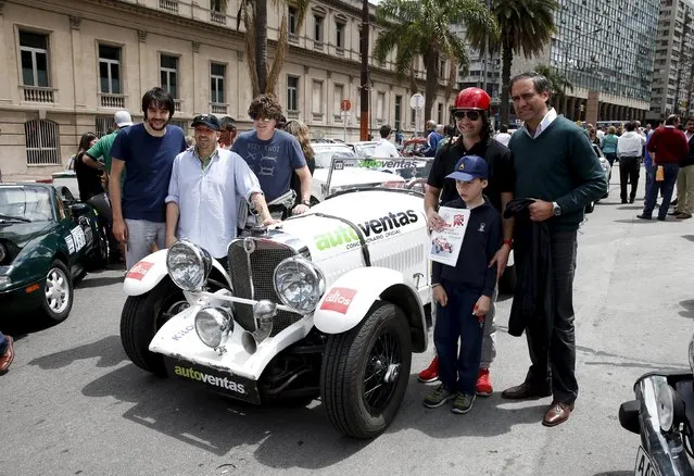 Participants pose with their 1929 Mercedes Benz before participating in the 25th edition of the "1000 millas sport e historicos" (1000 miles sports and classic) race in Montevideo, Uruguay October 28, 2015. The race will cover 1000 miles from 28 to 31 of October. (Photo by Andres Stapff/Reuters)