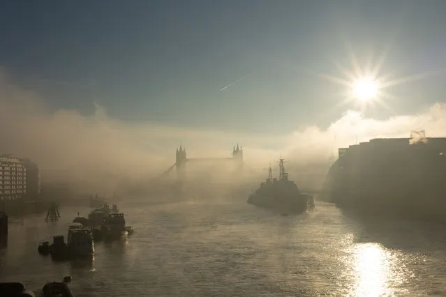 The Thames is shrouded in fog covering Tower Bridge on a sunny winters morning in London, United Kingdom on February 7, 2023. (Photo by Andy Hall/The Guardian)