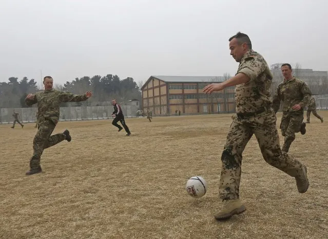 German and British troops participate in football match to commemorate the Christmas Truce of1914, at the ISAF Headquarters in Kabul December 24, 2014. (Photo by Omar Sobhani/Reuters)