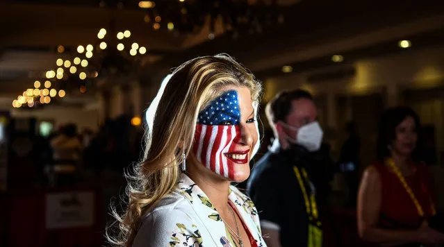 A woman with US flag painted on her face attends the Conservative Political Action Conference 2022 (CPAC) in Orlando, Florida on February 26, 2022. (Photo by Chandan Khanna/AFP Photo)