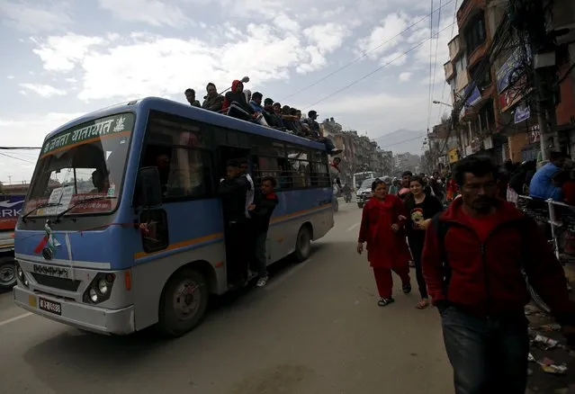 Passengers ride on an overcrowded bus as limited public transportation operates in the city during the ongoing fuel crises that has been continuing for over a month now in Kathmandu, Nepal October 30, 2015. Nepal signed a deal on Wednesday with China to import petroleum products, its embassy in Beijing said, as the Himalayan nation tries to boost supplies to deal with a deepening fuel crisis. (Photo by Navesh Chitrakar/Reuters)