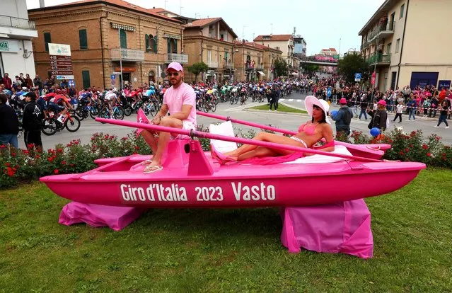A man and a woman sit on a boat displayed prior to the third stage of the Giro d'Italia 2023 cycling race, 216 km between Vasto and Melfi, on May 8, 2023. (Photo by Luca Bettini/AFP Photo)