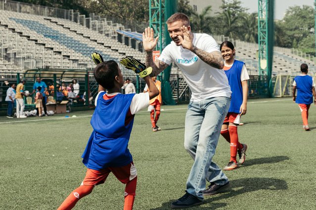 Sir David Beckham, Unicef’s goodwill ambassador, with children at the Cooperage Football Grounds in Mumbai on November 28, 2025. The children are enrolled in the Oscar Foundation’s football and life skills education programme. (Photo by UNICEF)