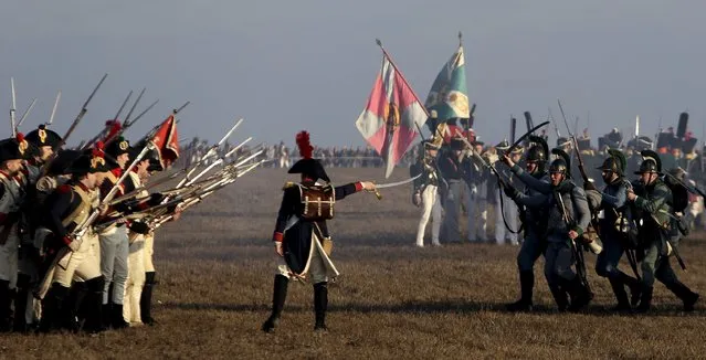 History enthusiasts, dressed as soldiers, fight during the re-enactment of Napoleon's famous battle of Austerlitz near the southern Moravian town of Slavkov u Brna December 5, 2015. (Photo by David W. Cerny/Reuters)