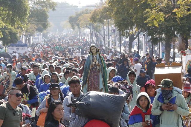 Pilgrims walk toward the Basilica of Guadalupe in Mexico City, Mexico, 10 December 2024. Mexican faithful have begun their annual pilgrimage to the Basilica of the Virgin of Guadalupe this week, with more than 12 million visitors expected by the Mexican government, on the Day of Our Lady of Guadalupe, celebrated on 12 December. (Photo by Mario Guzman/EPA)