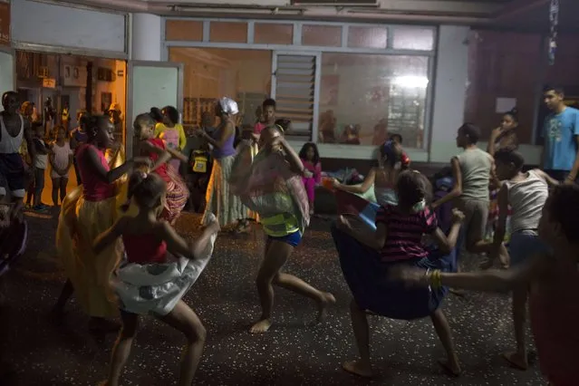 People rehearse a Contemporary Haitian dance in a communal center in downtown Havana January 30, 2015. (Photo by Alexandre Meneghini/Reuters)