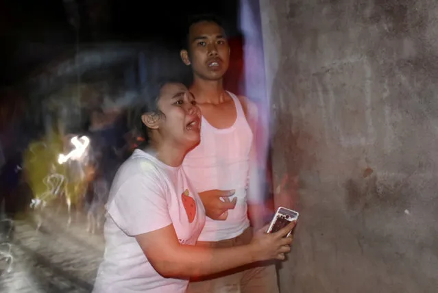 People react following an earthquake in Ampenan district, Mataram, Lombok, Indonesia, August  5, 2018. (Photo by Ahmad Subaidi/Antara Foto via Reuters)