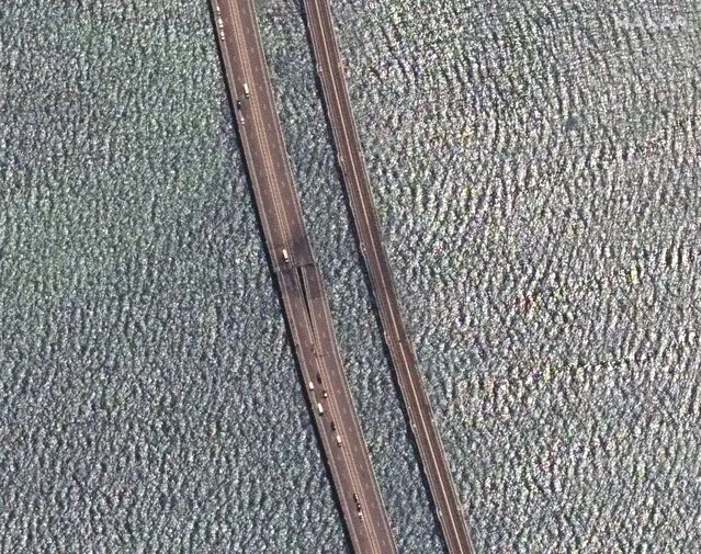 This image provided by Maxar Technologies, shows damaged parts of an automobile link of the Crimean Bridge connecting Russian mainland and Crimean peninsula over the Kerch Strait not far from Kerch, Crimea on Monday, July 17, 2023. (Photo by Satellite image 2023 Maxar Technologies via AP Photo)