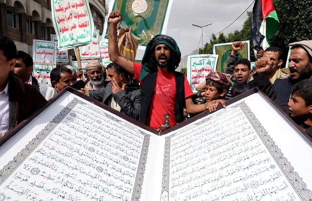 People rally to denounce the burning of the Koran in Sweden and the Israeli military operation in the West Bank city of Jenin, in Sanaa, Yemen on July 4, 2023. (Photo by Khaled Abdullah/Reuters)