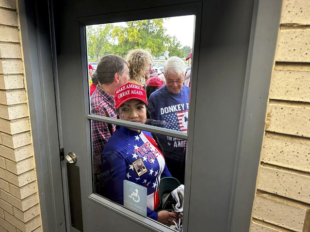 Supporters wait to enter a commit to caucus rally for former President Donald Trump, Wednesday, September 20, 2023, in Maquoketa, Iowa. (Photo by Charlie Neibergall/AP Photo)