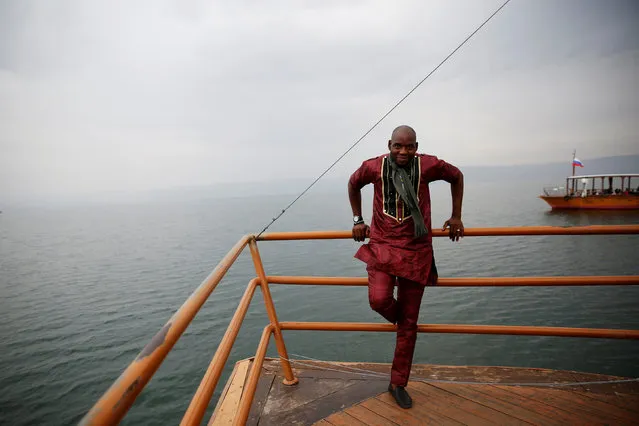 A Christian tourist from Nigeria stands during a boat ride in the Sea of Galilee, northern Israel November 30, 2016. (Photo by Ronen Zvulun/Reuters)