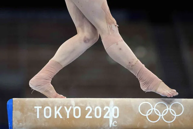 Guan Chenchen, of China, wins the gold medal as she performs on the balance beam during the artistic gymnastics women's apparatus final at the 2020 Summer Olympics, Tuesday, August 3, 2021, in Tokyo, Japan. (Photo by Ashley Landis/AP Photo)