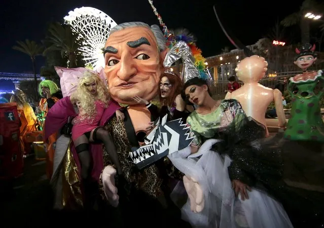 Revellers pose with a giant figure of former IMF head Dominique Strauss-Kahn during “Lou Queernaval” parade, the first lesbian, gay, bisexual and transgender (LGBT) carnival in France, as part of the Carnival of Nice February 19, 2016. (Photo by Eric Gaillard/Reuters)