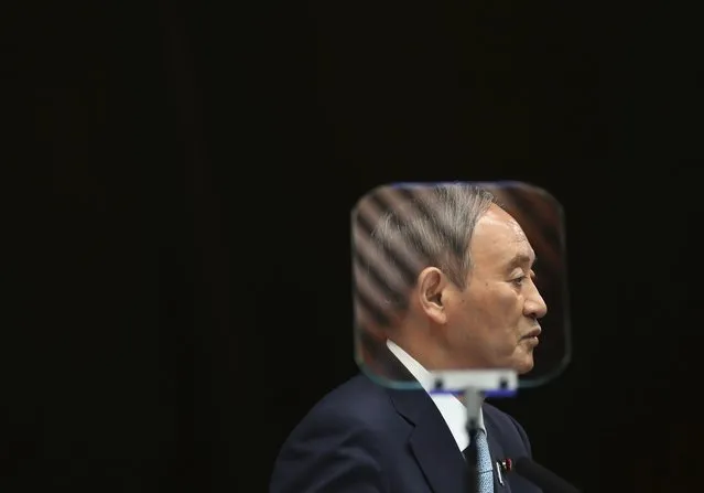 Japanese Prime Minister Yoshihide Suga is seen through a teleprompter as he speaks during his news conference at his office in Tokyo, Thursday, September 9, 2021. Japan announced Thursday it is extending a coronavirus state of emergency in Tokyo and 18 other areas until the end of September as health care systems remain under severe strain, although new infections have slowed slightly. (Photo by Kim Kyung-Hoon/Pool Photo via AP Photo)