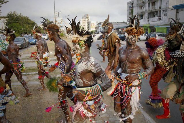Members of the panther men of Liabo, an Ivorian traditional dance group, perform in a street during the MASA (Market for African Performing Arts) in Abidjan March 11, 2016. (Photo by Luc Gnago/Reuters)