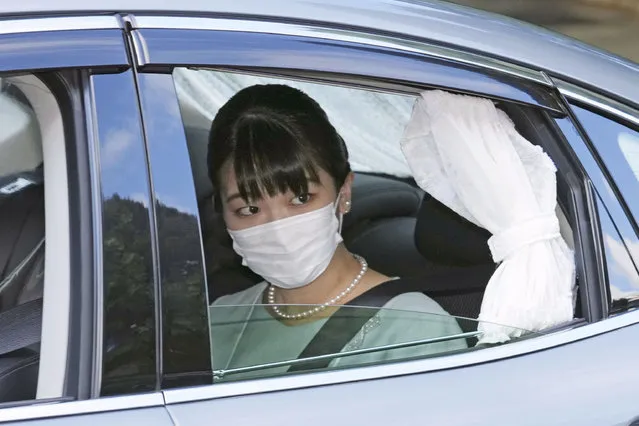 Japan's Princess Mako in a car leaves her home in Akasaka Estate in Tokyo Tuesday, October 26, 2021. Mako and her commoner boyfriend Kei Komuro tied the knot Tuesday without wedding celebration in a marriage that has split the public opinion over her would-be mother-in-law’s financial controversy. (Photo by Chika Oshima/Kyodo News via AP Photo)