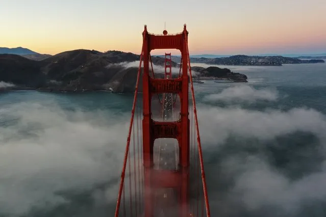 San Francisco's most iconic weather fog blankets the Golden Gate Bridge during sunset as seen from Marin Headlands of Sausalito in California, United States on October 17, 2023. (Photo by Tayfun Coskun/Anadolu via Getty Images)