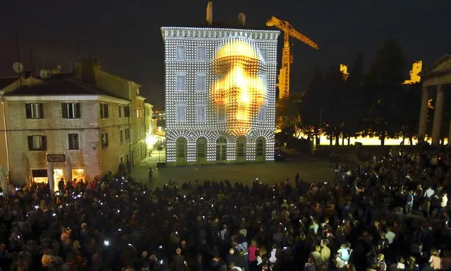 A 3D video mapping is seen on historic building during Visualia Festival in the Adriatic town of Pula, Croatia May 8, 2015. Visualia Festival is a festival of audio-visual art with the objective of modernizing and approaching new technologies to citizens. The third edition of the festival will offer light exhibitions, 3D video mapping on historic buildings of the city and light installations. (Photo by Antonio Bronic/Reuters)