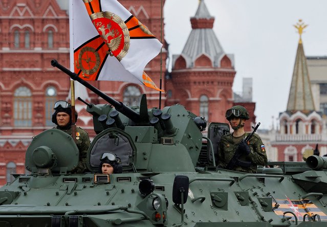 Russian service members ride on an armoured personnel carrier during a military parade on Victory Day in Red Square in Moscow, Russia on May 9, 2024. (Photo by Evgenia Novozhenina/Reuters)