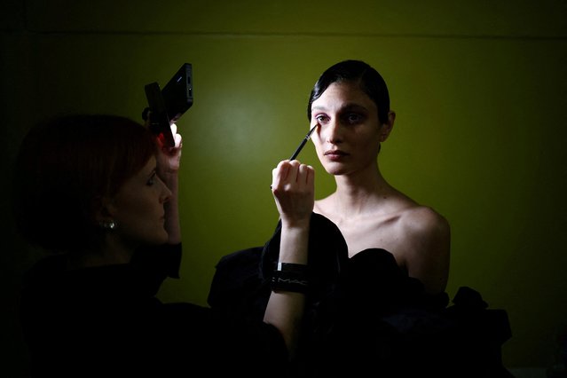 A model prepares backstage ahead of the Richard Quinn catwalk show during London Fashion Week in London, Britain on February 18, 2023. (Photo by Henry Nicholls/Reuters)