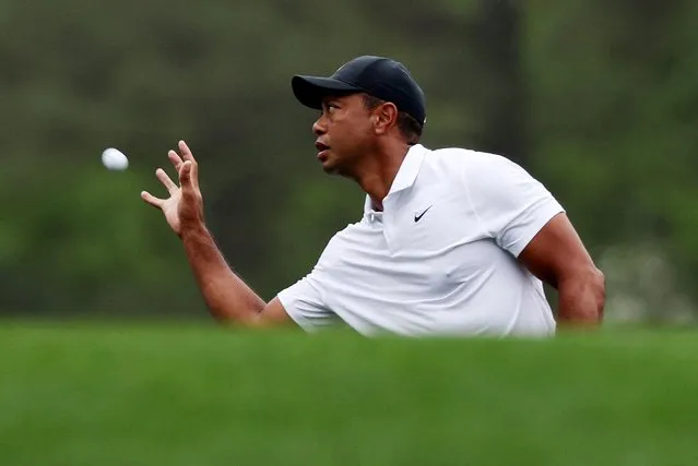 Tiger Woods of the U.S. catches a golf ball on the 11th green during a practice round at Augusta National Golf Club, Augusta, Georgia on April 6, 2022. (Photo by Mike Blake/Reuters)