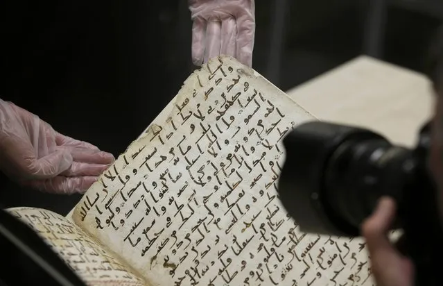 A fragment of a Koran manuscript is photographed in the library at the University of Birmingham in Britain July 22, 2015. (Photo by Peter Nicholls/Reuters)