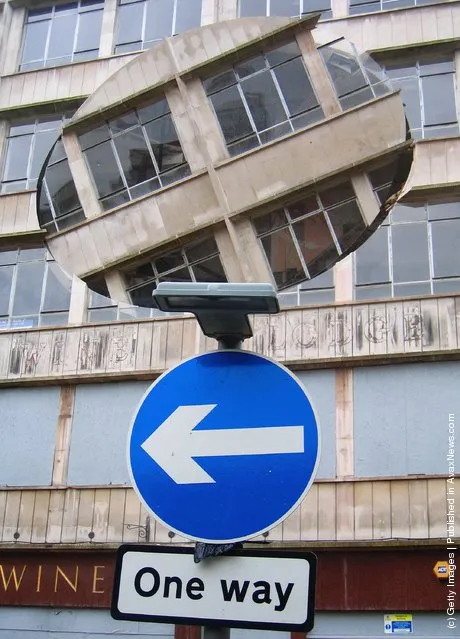 An installation by the artist Richard Wilson, entitled 'Turning the Place Over', is built into the condemned Cross Keys House in Moorfields as part of the Capital of Culture for 2008