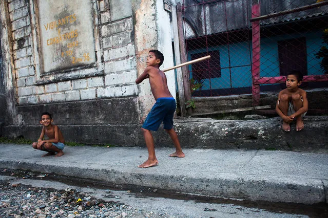 “We still play”. This photo is take in Baracoa, Cuba. Even though is an outdoor scene I believe it gives a sense of Cuba. I only realised fully how amazing Cuba is when I left for Mexico. In Cuba, children still play in the street, it doesn't matter how but they do, even if the don't have a baseball bat! It's a fear free society even though it's changing. People have their doors open, children play outside anytime with anyone and people still trust. It's a beautiful thing going on that reminded me my childhood years in Greece. Photo location: Baracoa, Cuba. (Photo and caption by Stylianos Papardelas/National Geographic Photo Contest)